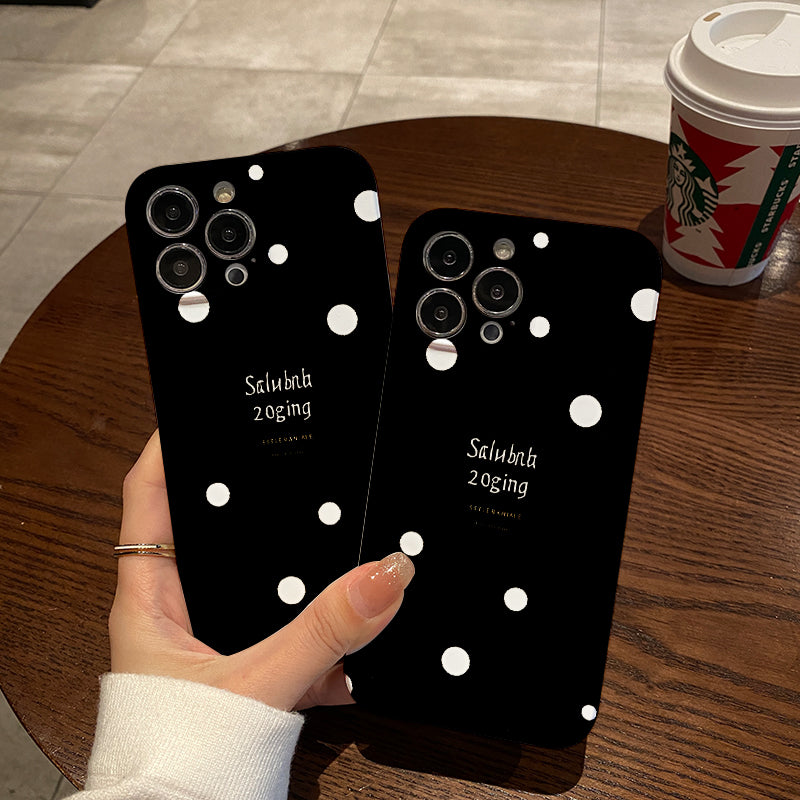 Piece of a Stylish And White Polka Dot Phone Case That Offers a Comfortable Grip And Durability.