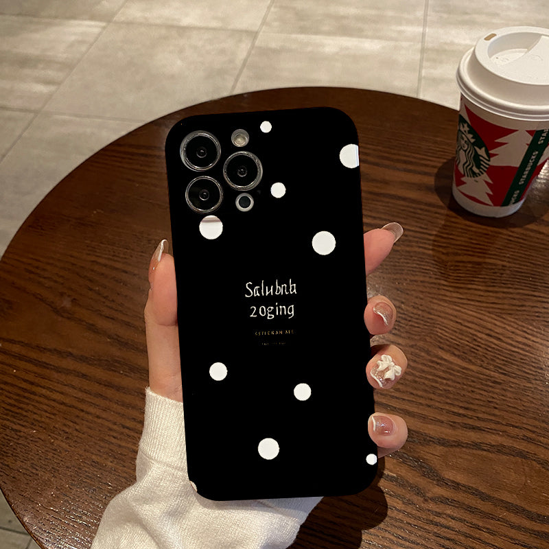 Piece of a Stylish And White Polka Dot Phone Case That Offers a Comfortable Grip And Durability.