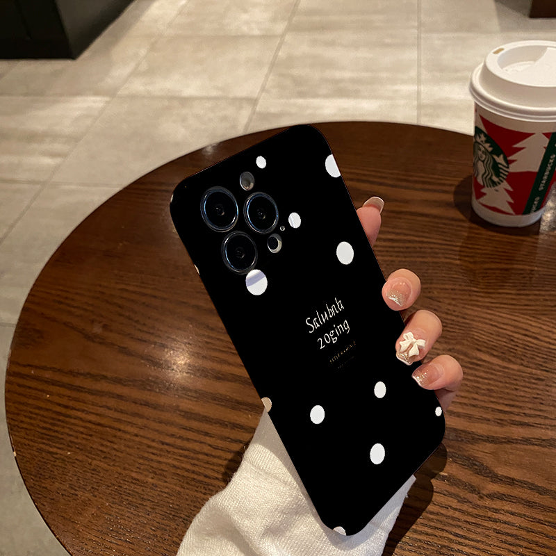 Piece of a Stylish And White Polka Dot Phone Case That Offers a Comfortable Grip And Durability.