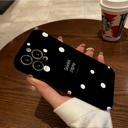 Piece of a Stylish And White Polka Dot Phone Case That Offers a Comfortable Grip And Durability.