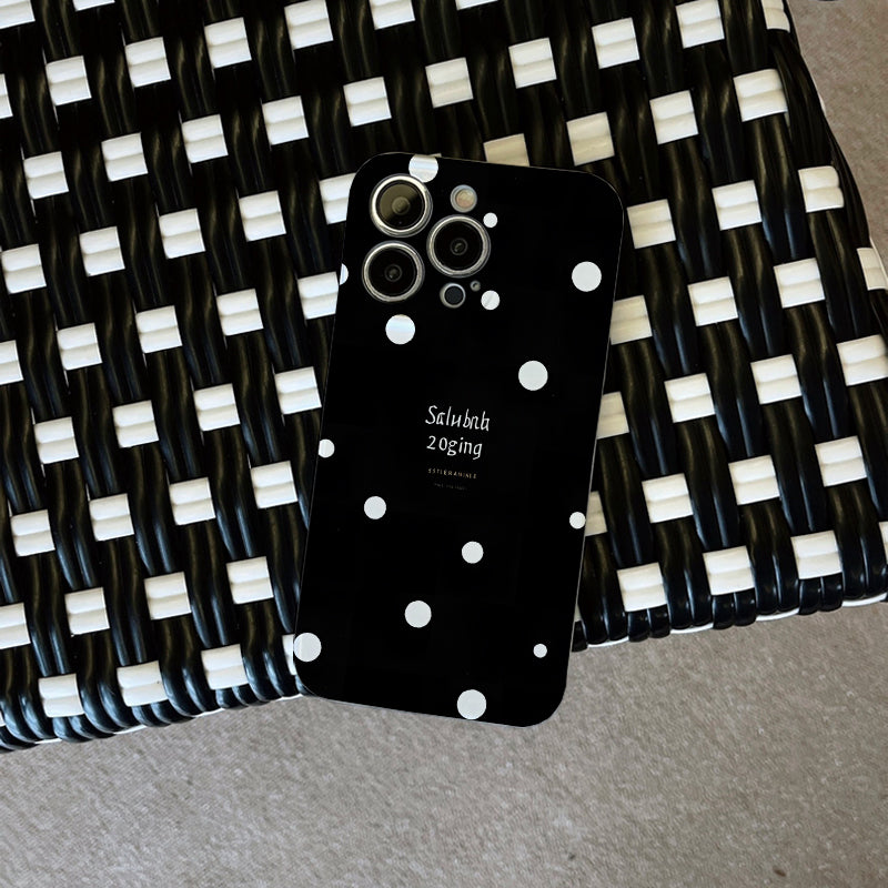 Piece of a Stylish And White Polka Dot Phone Case That Offers a Comfortable Grip And Durability.