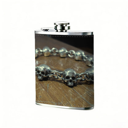 Skull metal bracelet on wooden table 1pc Stainless Steel Flask 8oz -Fashionable patterns Design, Ideal for Dad, Grandpa, Uncle, Hunting Enthusiasts, Birthday, Party, Christmas, Halloween Gifts