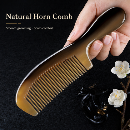 Natural Fuzhou horn comb with polished amber grain on a dark background